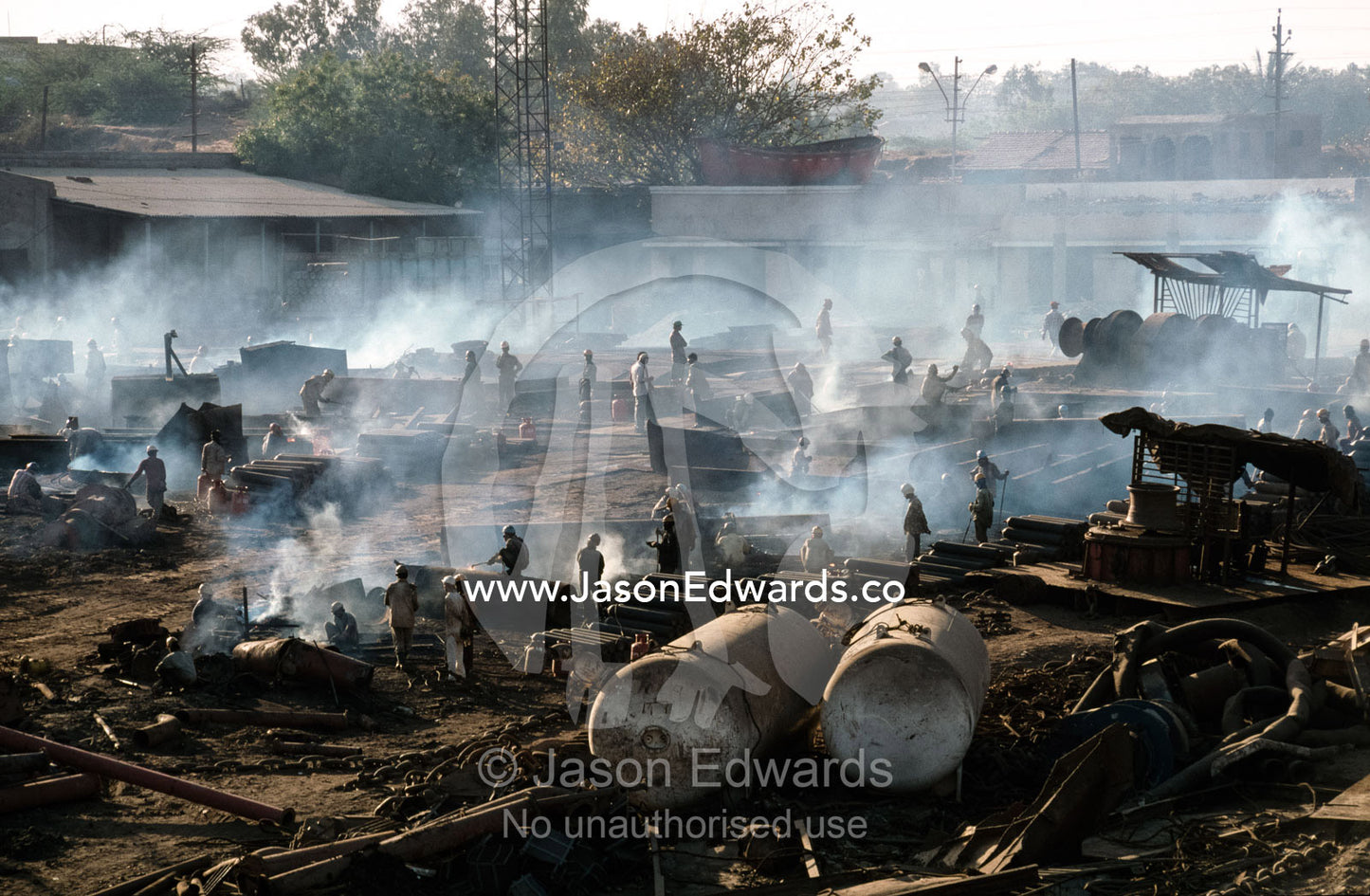 Cutters labor in a world of acrid smoke and explosive gases. Alang, India.