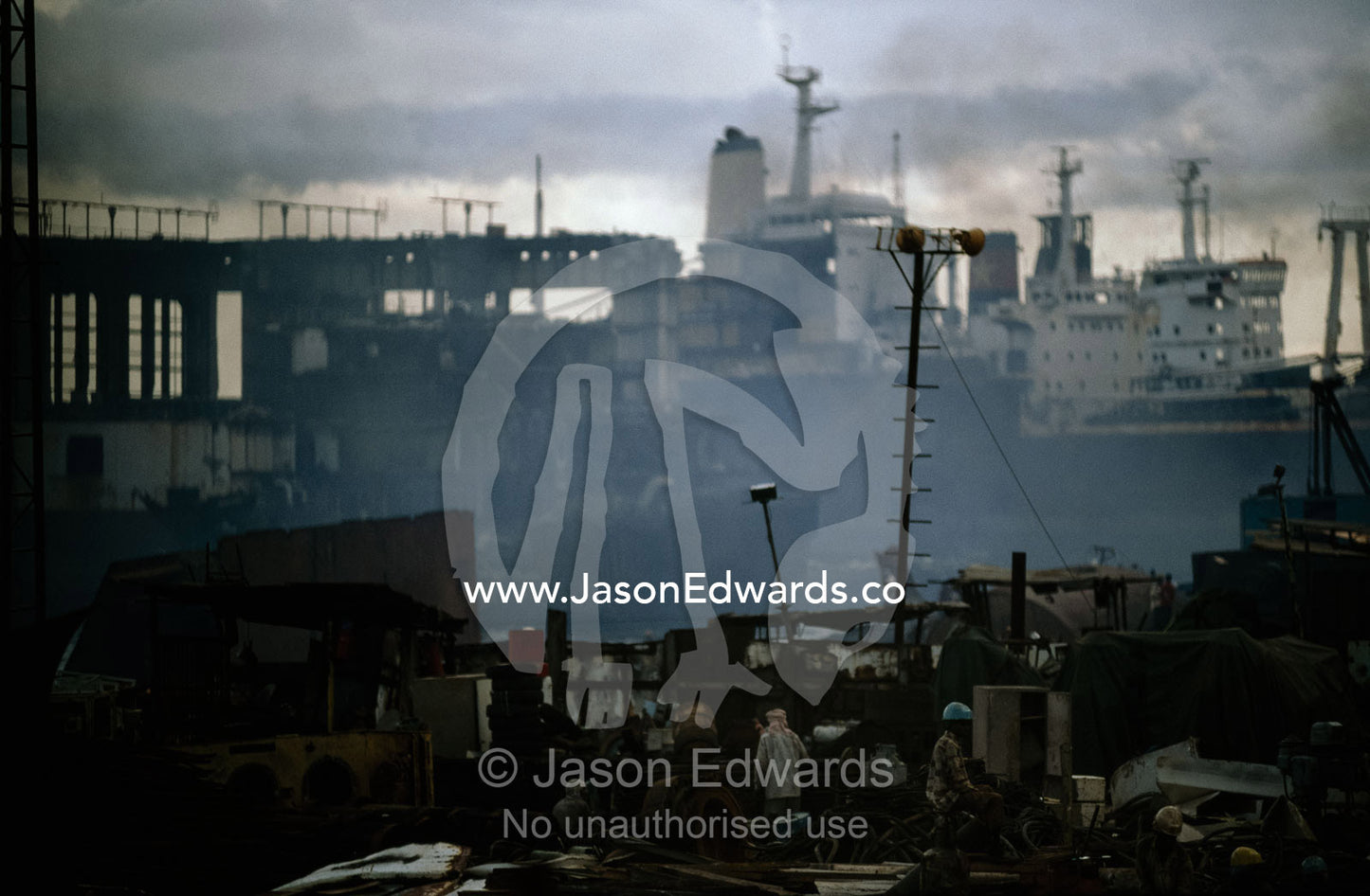 Cutters labor in a world of acrid smoke and explosive gases. Alang, India.