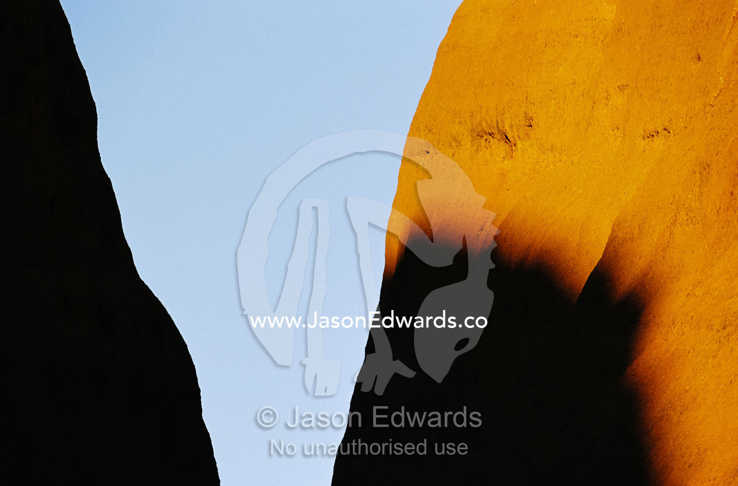 Rock formations and shadows at twilight in Uluru National Park. Uluru National Park, Northern Territory, Australia.
