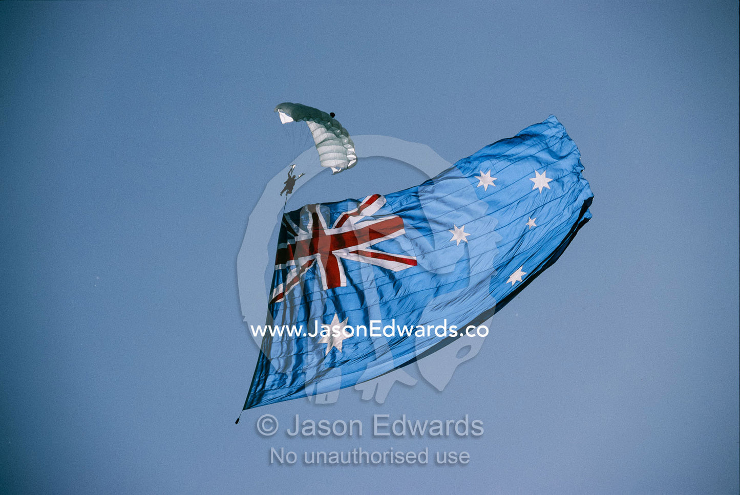 Parachutist jumping with the Australian flag at the Avalon Airshow. Victoria, Australia.