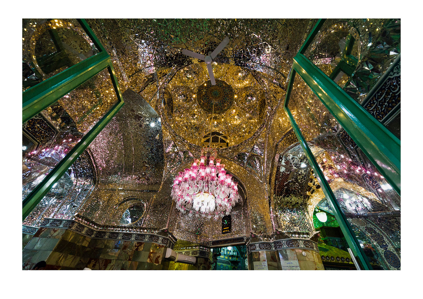 Light from the chandelier reflecting in all directions from the magnificent mirrored ceiling of the Holy shrine of Hazrat Masuma.
Fatima Masumeh Shrine, Qom, Qom Province, Islamic Republic of Iran.