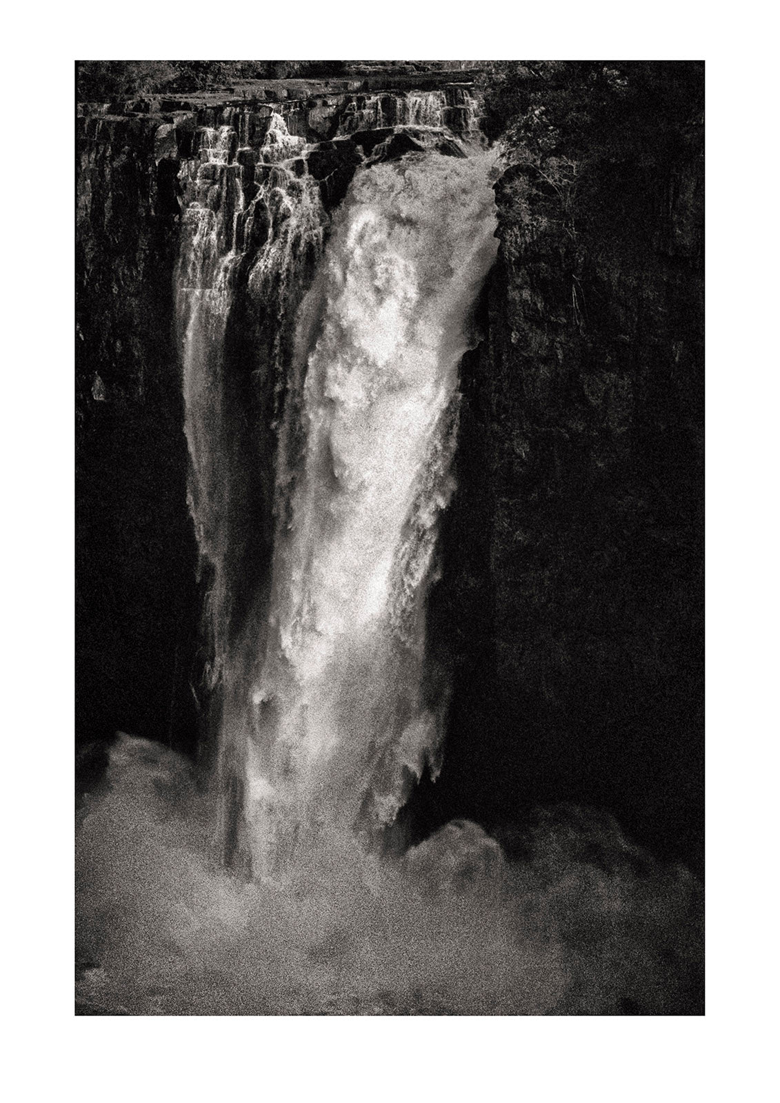 The mighty Victoria Falls cascades into the abyss #2. Captured on Ilford HP5 black and white negative film. Victoria Falls National Park, Zimbabwe.