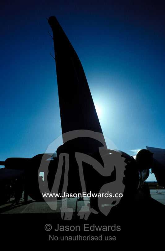 A menacing F111 jet fighter bomber tail wing silhouette. Avalon International Airshow, Victoria Australia