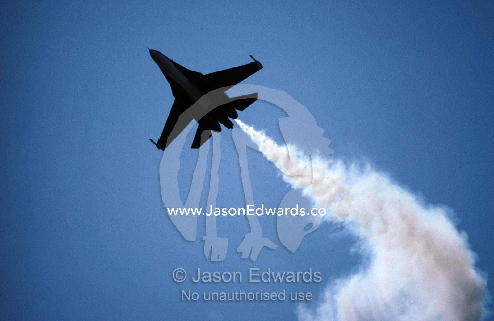 A SU27 Russian jet fighter trailing smoke during an acrobatic display. Avalon International Airshow, Victoria Australia