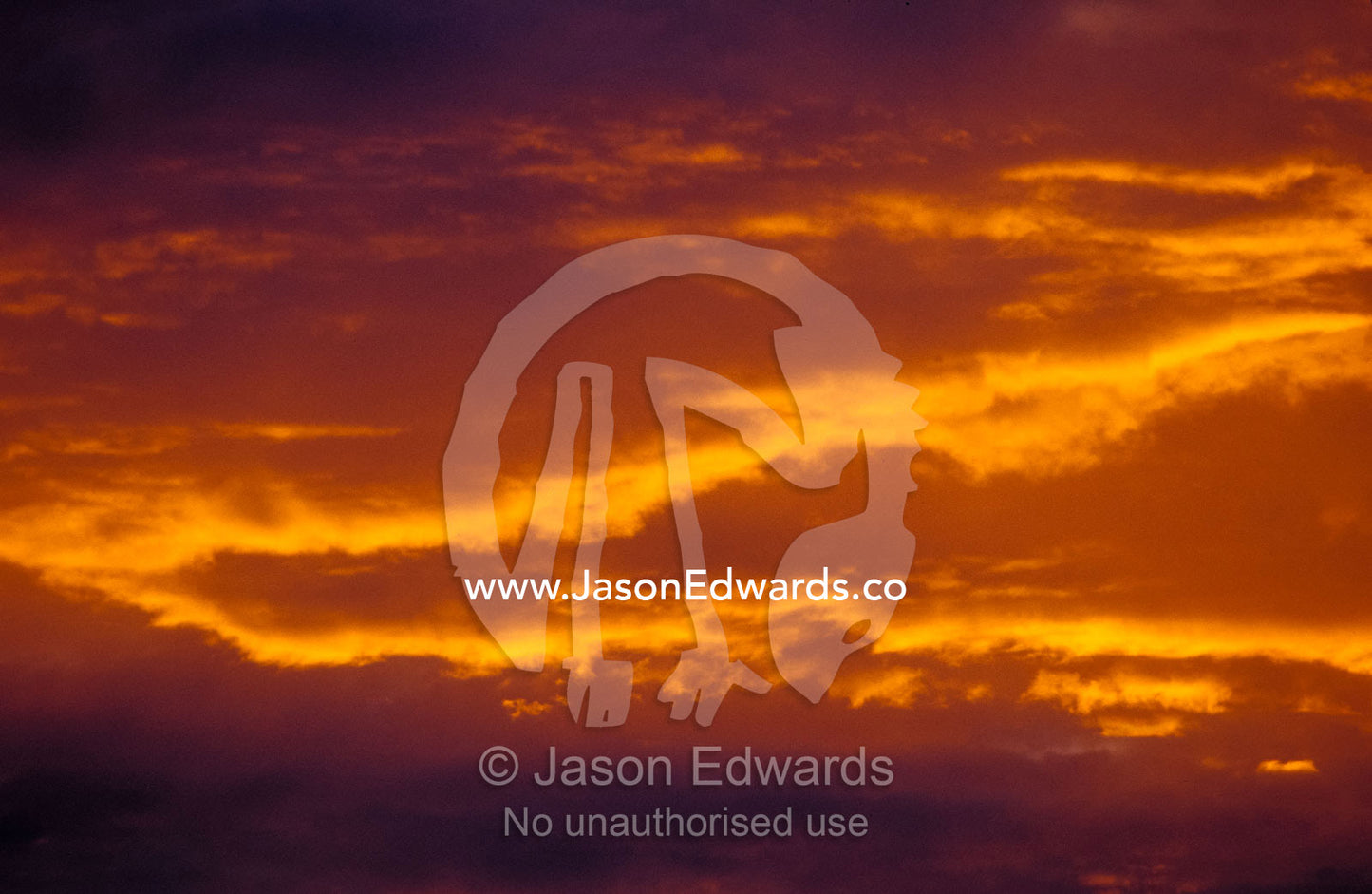 Spectacular red, orange and yellow gold cloud formations at sunset. Healesville, Coranderrk, Victoria, Australia.