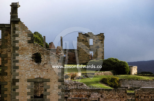 Barred windows and stone ruins at Port Arthur convict penal colony. Port Arthur Penal Settlement Tasmania Australia.