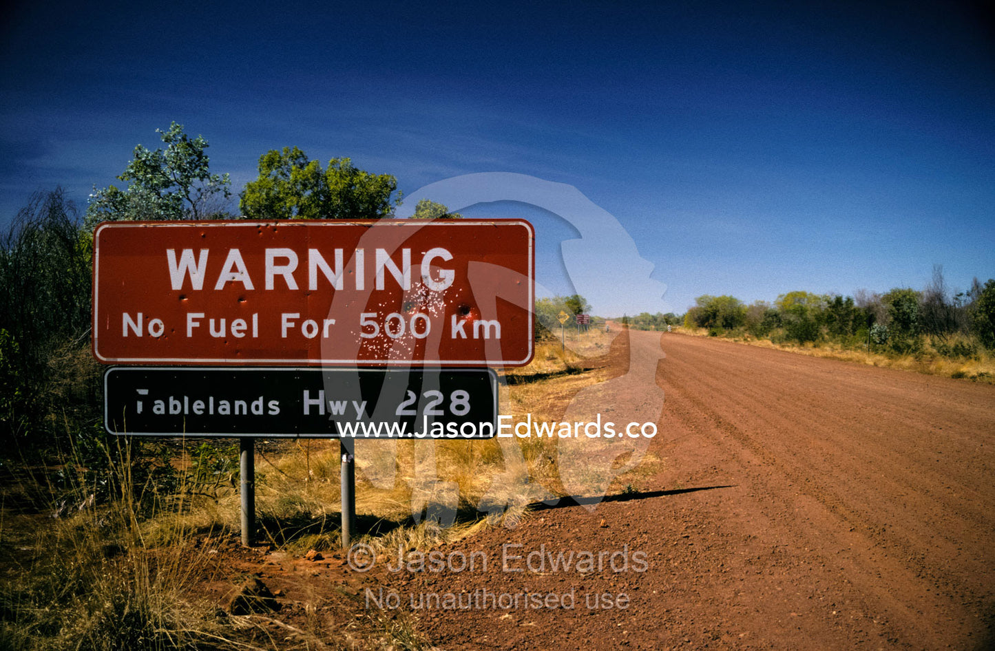 Cautionary fuel sign warning tourist of danger in the isolated outback Outback Southern Northern Territory, Australia.