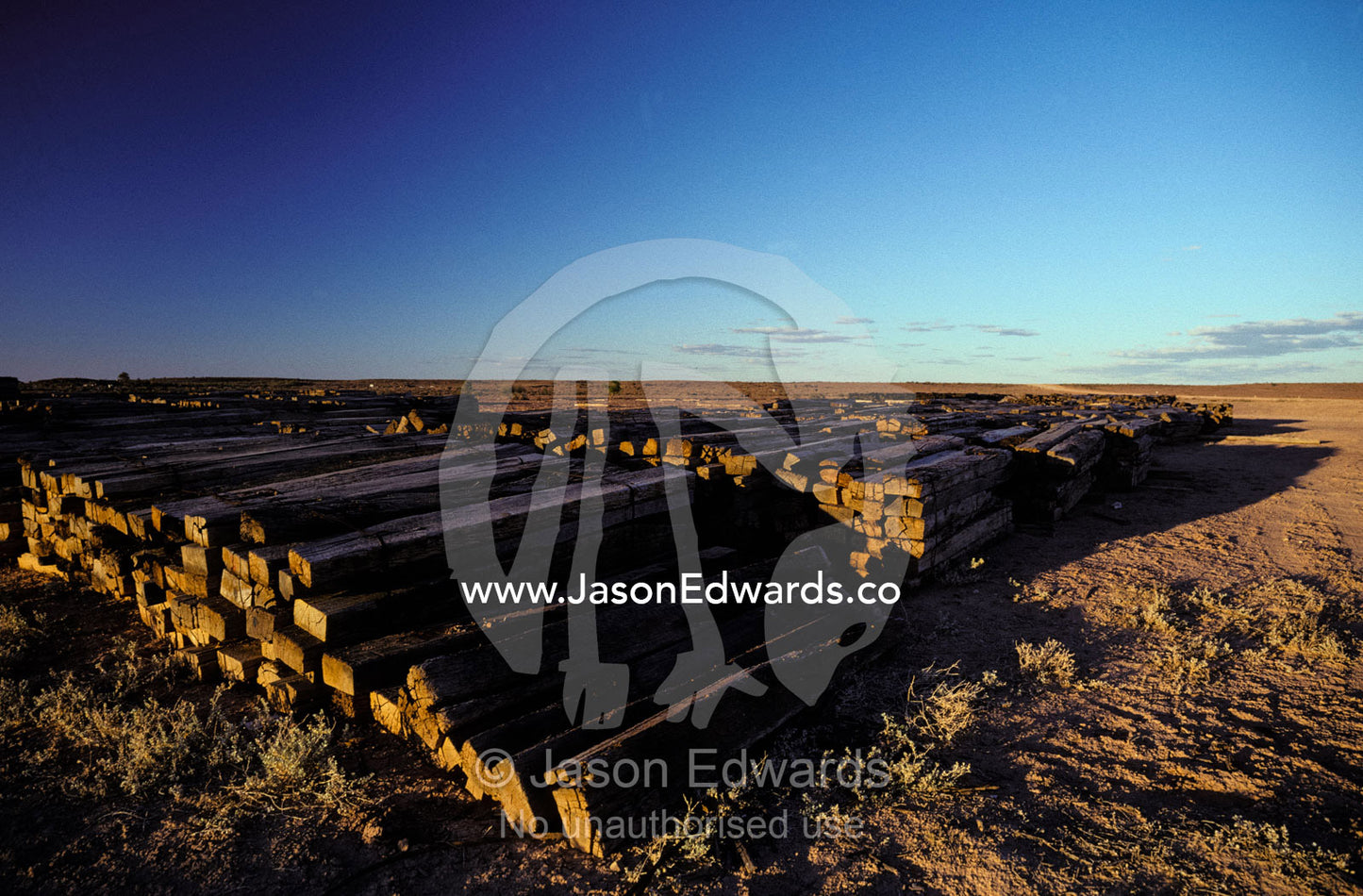 Discarded old Ghan Railway wooden rail sleepers in the desert. Leigh Creek, South Australia.