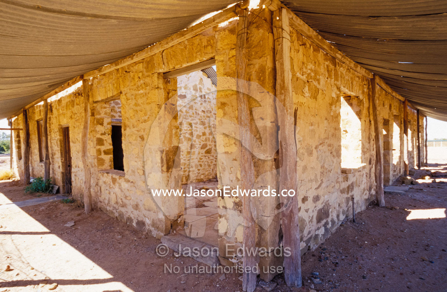 The outback Hotel Royal ruin corrugated iron verandah and brick walls. Birdsville, Queensland, Australia.