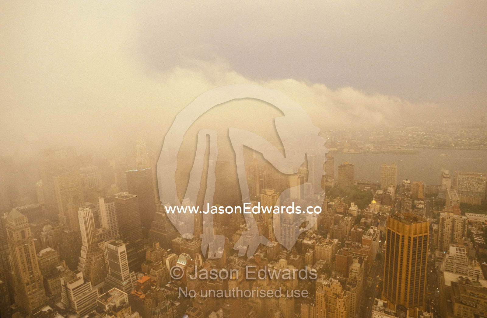 Aerial of New York City architecture and Bay with menacing icy storm. New York City, United States of America.