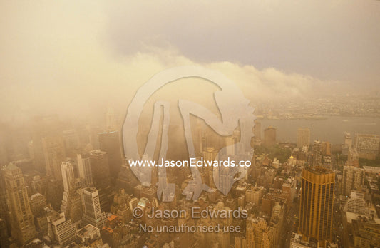 Aerial of New York City architecture and Bay with menacing icy storm. New York City, United States of America.