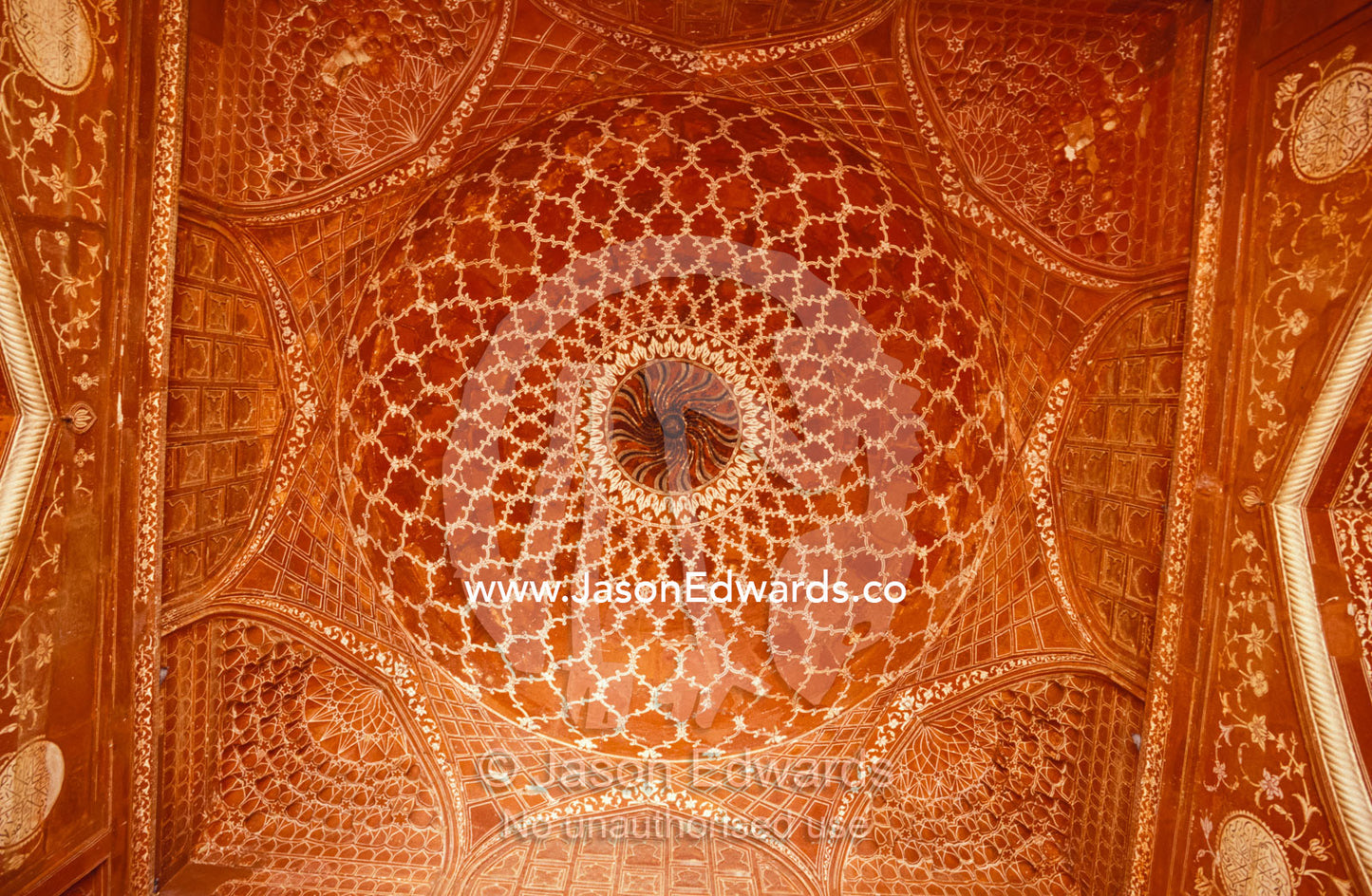 The intricate inlay and carving of a mosque ceiling at the Taj Mahal. Agra, India