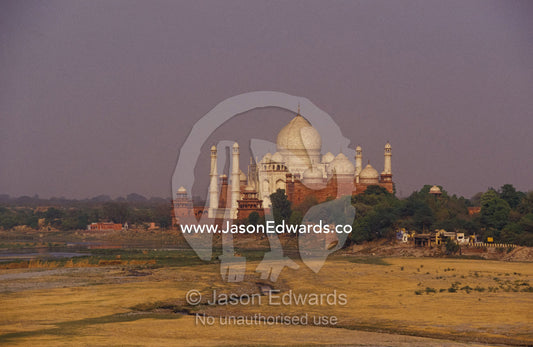 The Taj Mahal domes and Yamuna River floodplain from the Agra Fort. Agra, India.