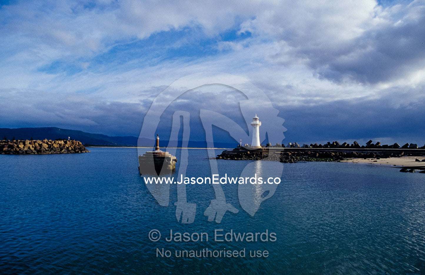 A Lighthouse and Beacon at the Mariner entrance to a safe port. Woollongong, New South Wales, Australia.