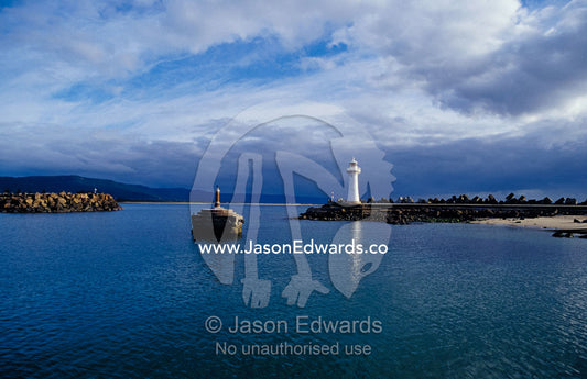 A Lighthouse and Beacon at the Mariner entrance to a safe port. Woollongong, New South Wales, Australia.