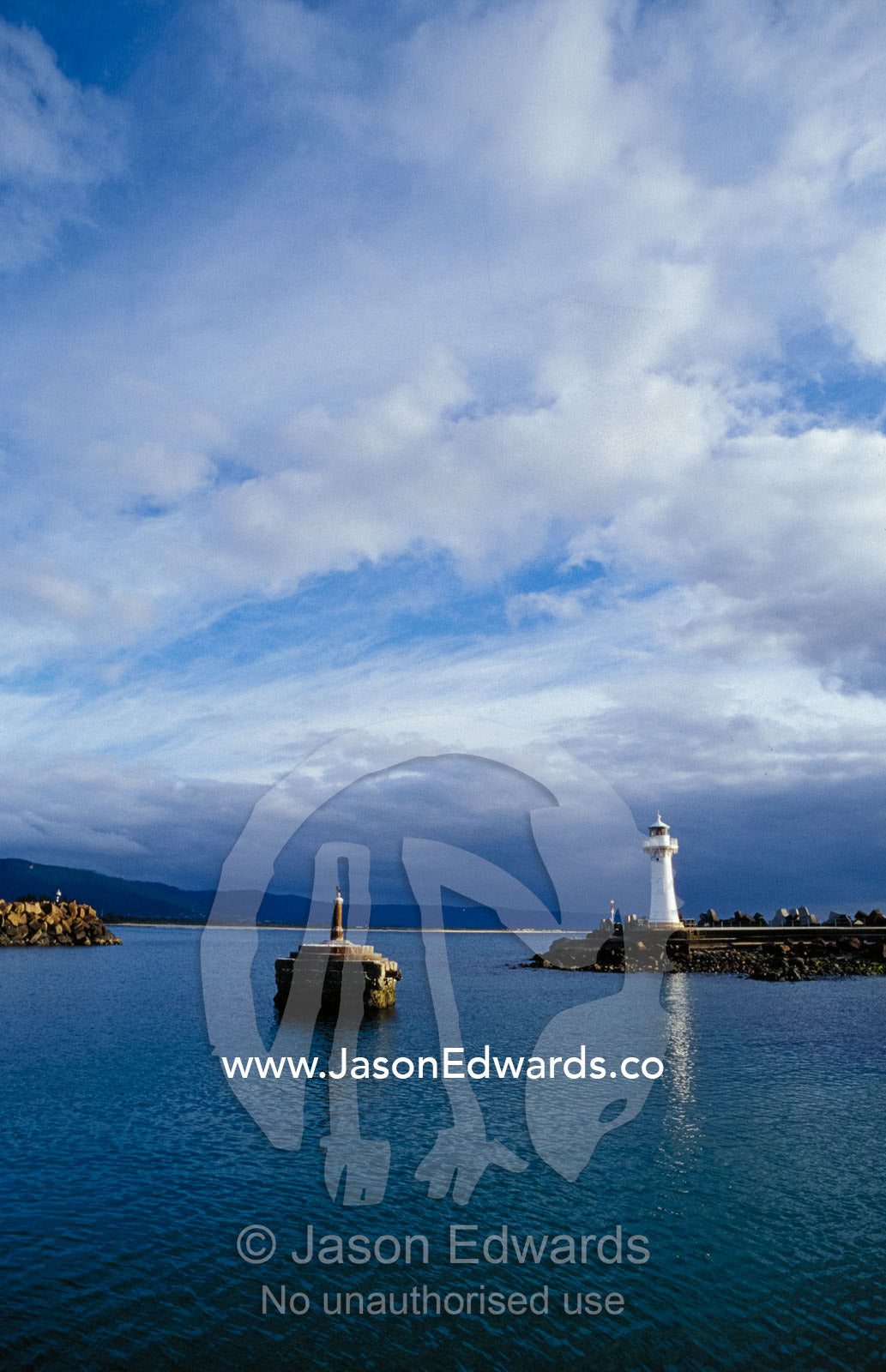 A Lighthouse and Beacon at the Mariner entrance to a safe port. Woollongong, New South Wales, Australia.