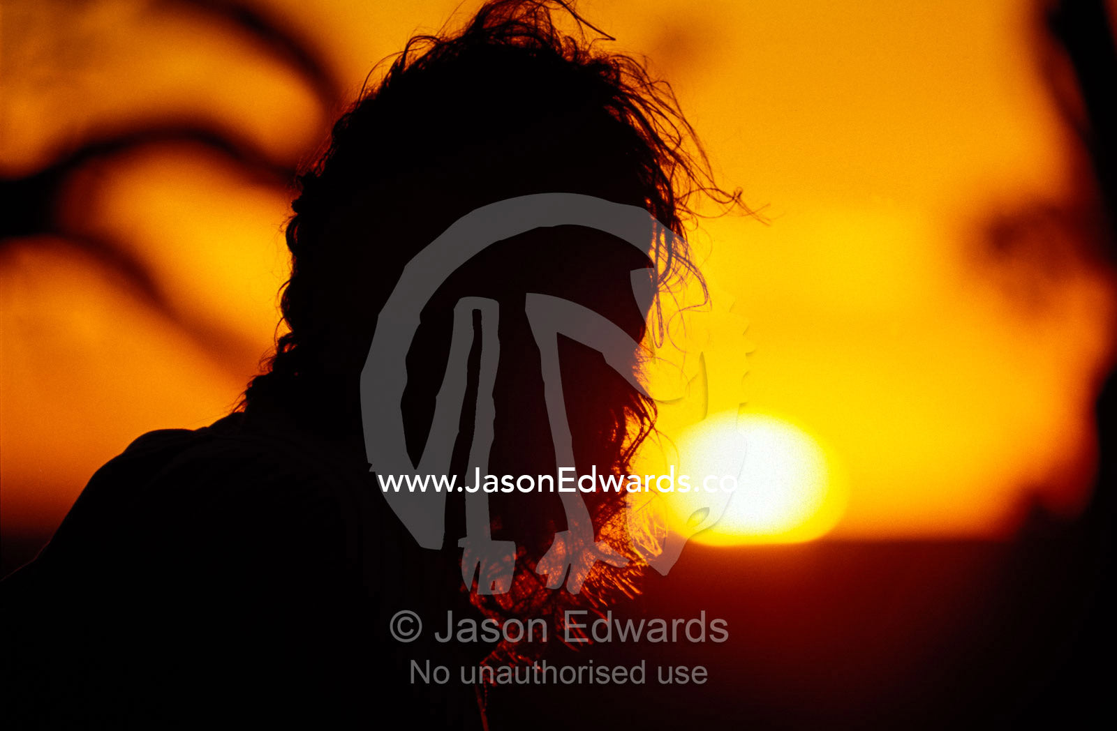 Silhouette of an Aboriginal Dja Dja Wrung Tribal Elder at sunset. Kooyoora State Park, Victoria, Australia.