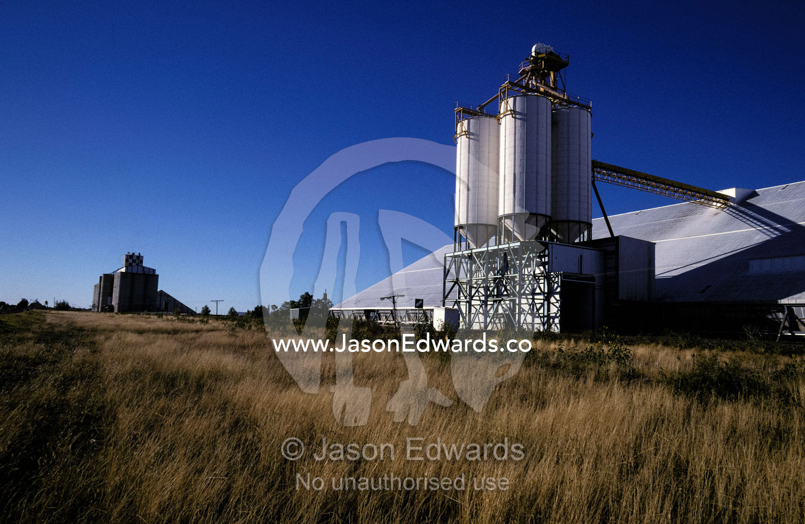 A wheat depot and silos connected to a railway line for transport. Moree, New South Wales, Australia.