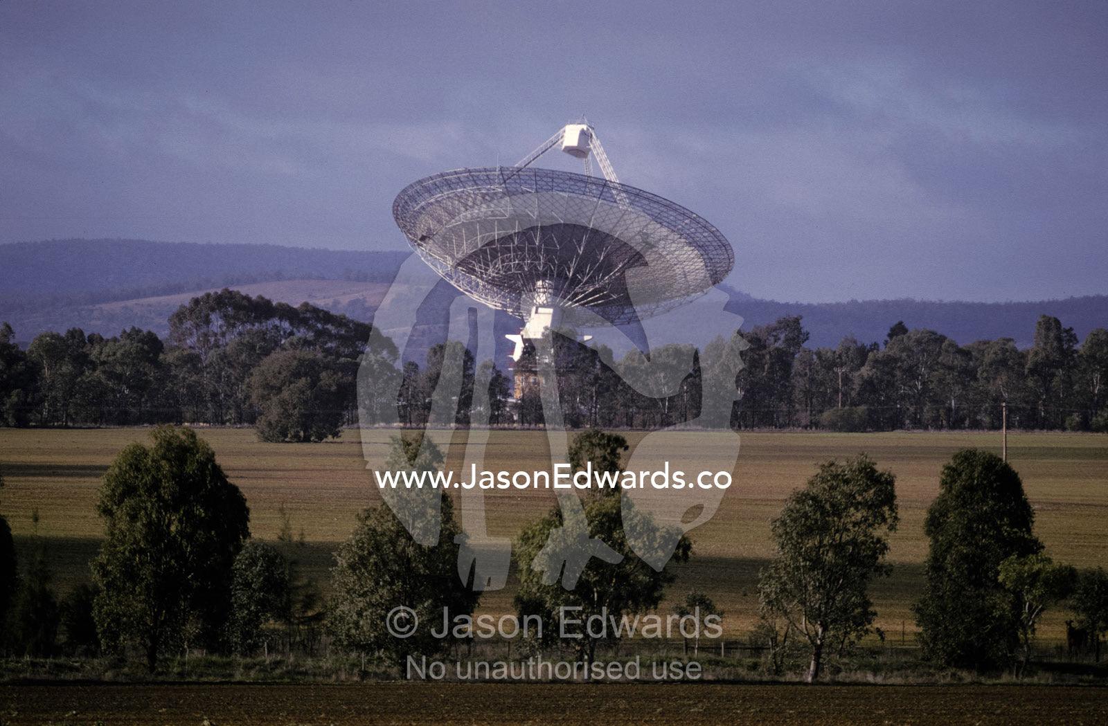 A giant Radio Telescope surrounded by farmland. Parkes, New South Wales, Australia.