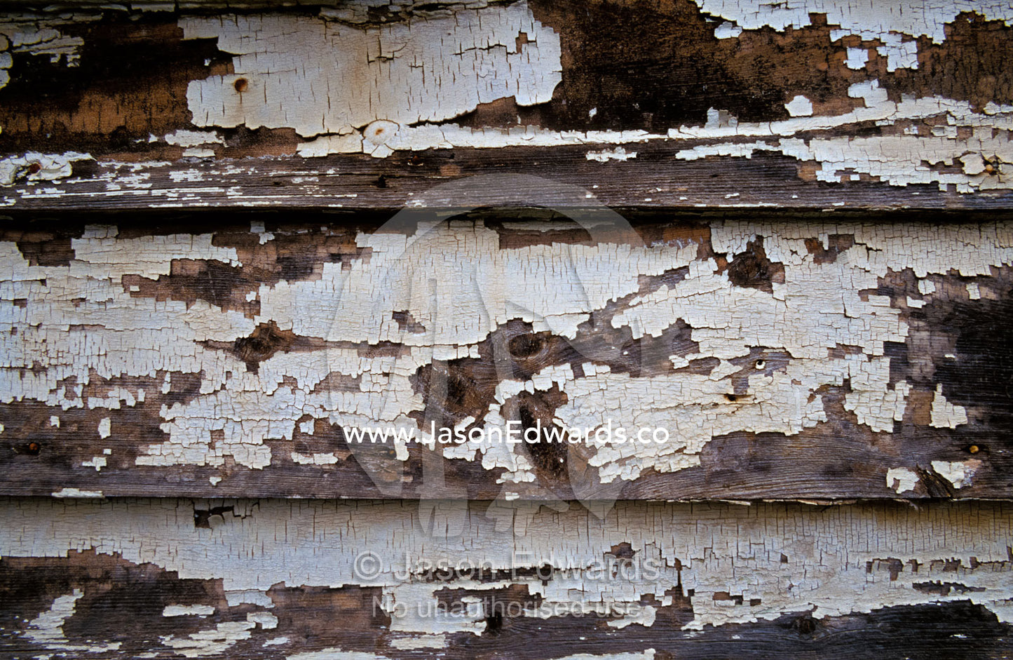 Paint peeling off the boards of an old country house. Wedderburn, Victoria, Australia.