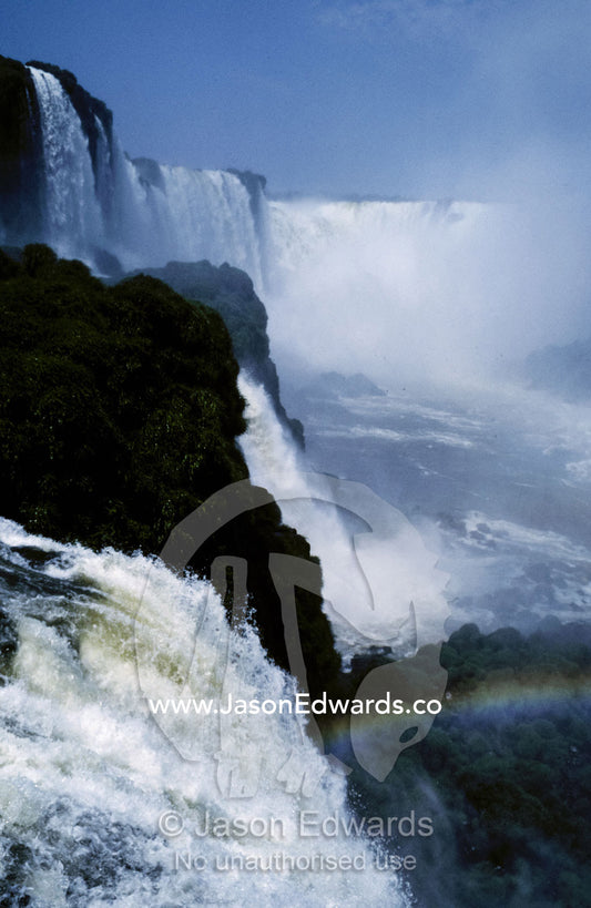 The thunderous roar of the Devils Throat, Garganta del Diablo, falls. Rio Iguazu, Parque Nacional do Iguacu, Brazil