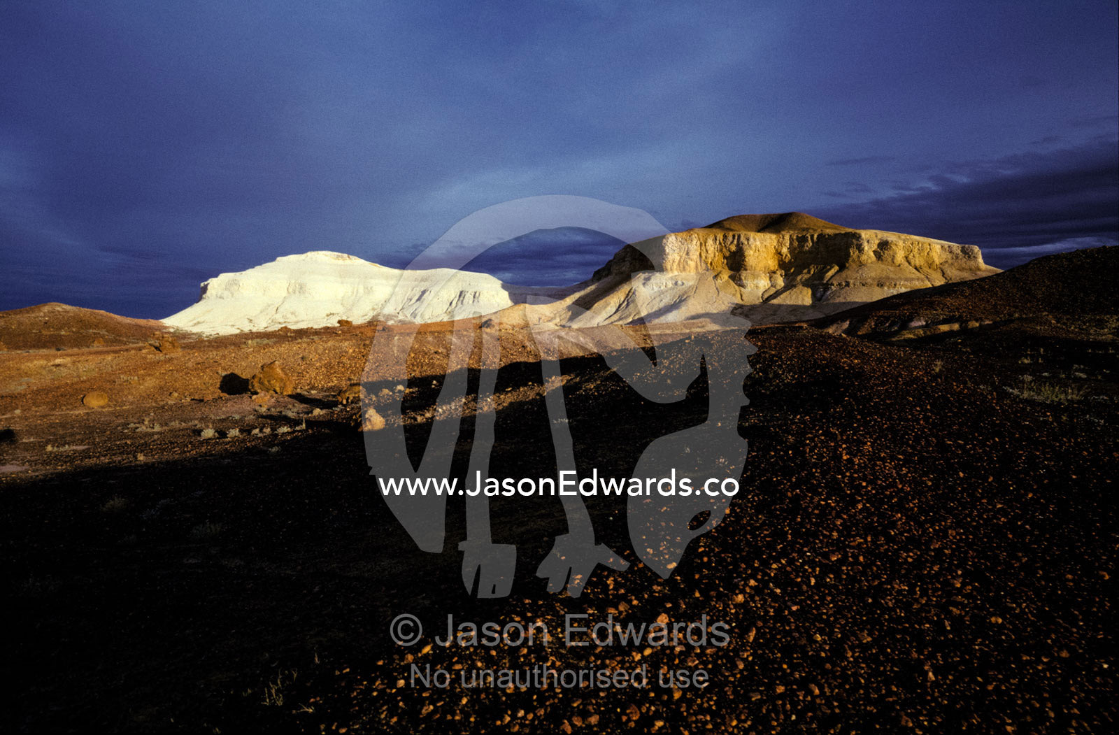 The ancient sandstone formations of the Breakaway Ranges at sunset. Breakaway Ranges Reserve, South Australia.