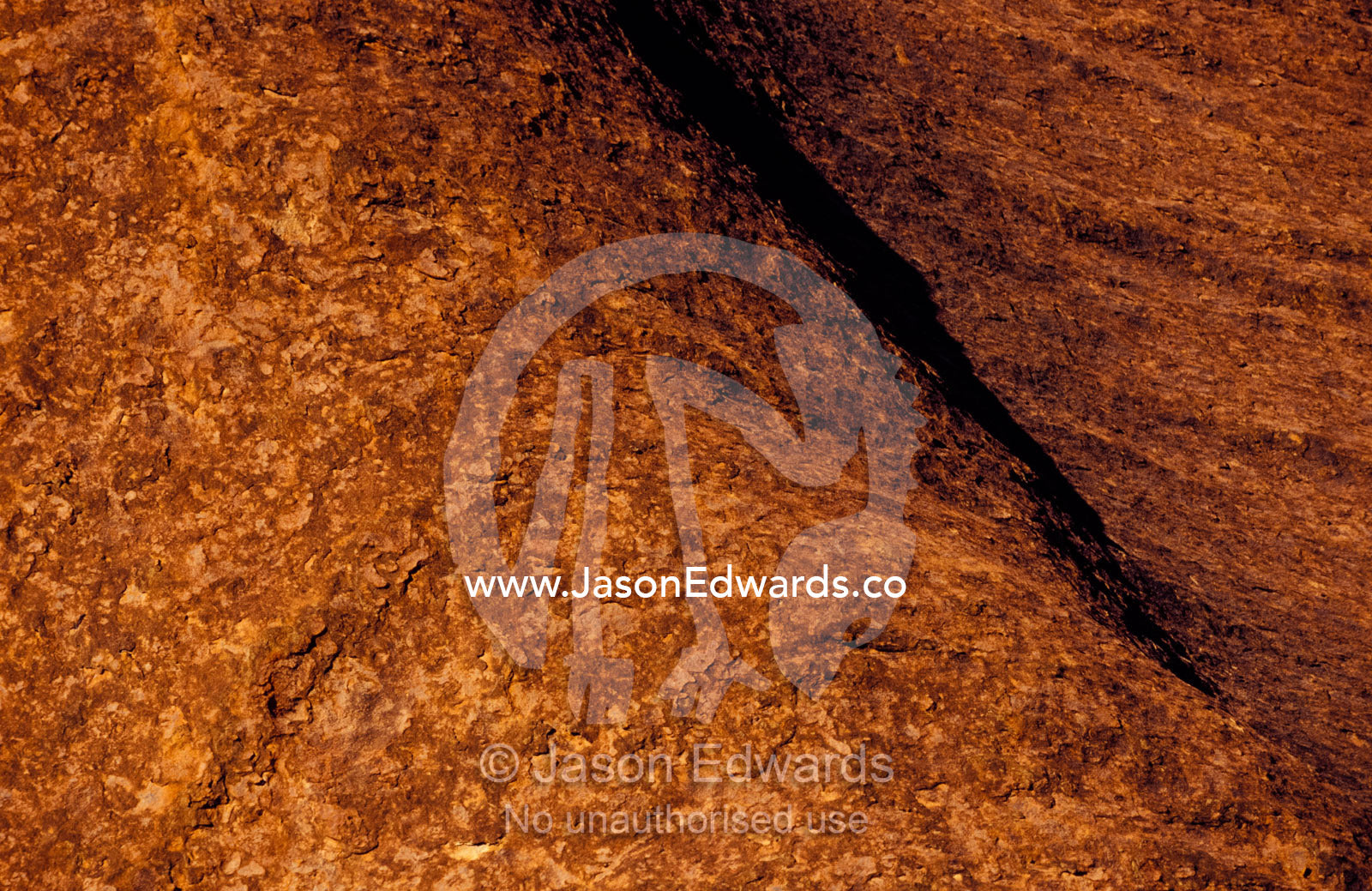 The rust oxidisation on the sandstone surface of Uluru, Ayres Rock. Uluru, Kata Tjuta National Park, Northern Territory, Australia.