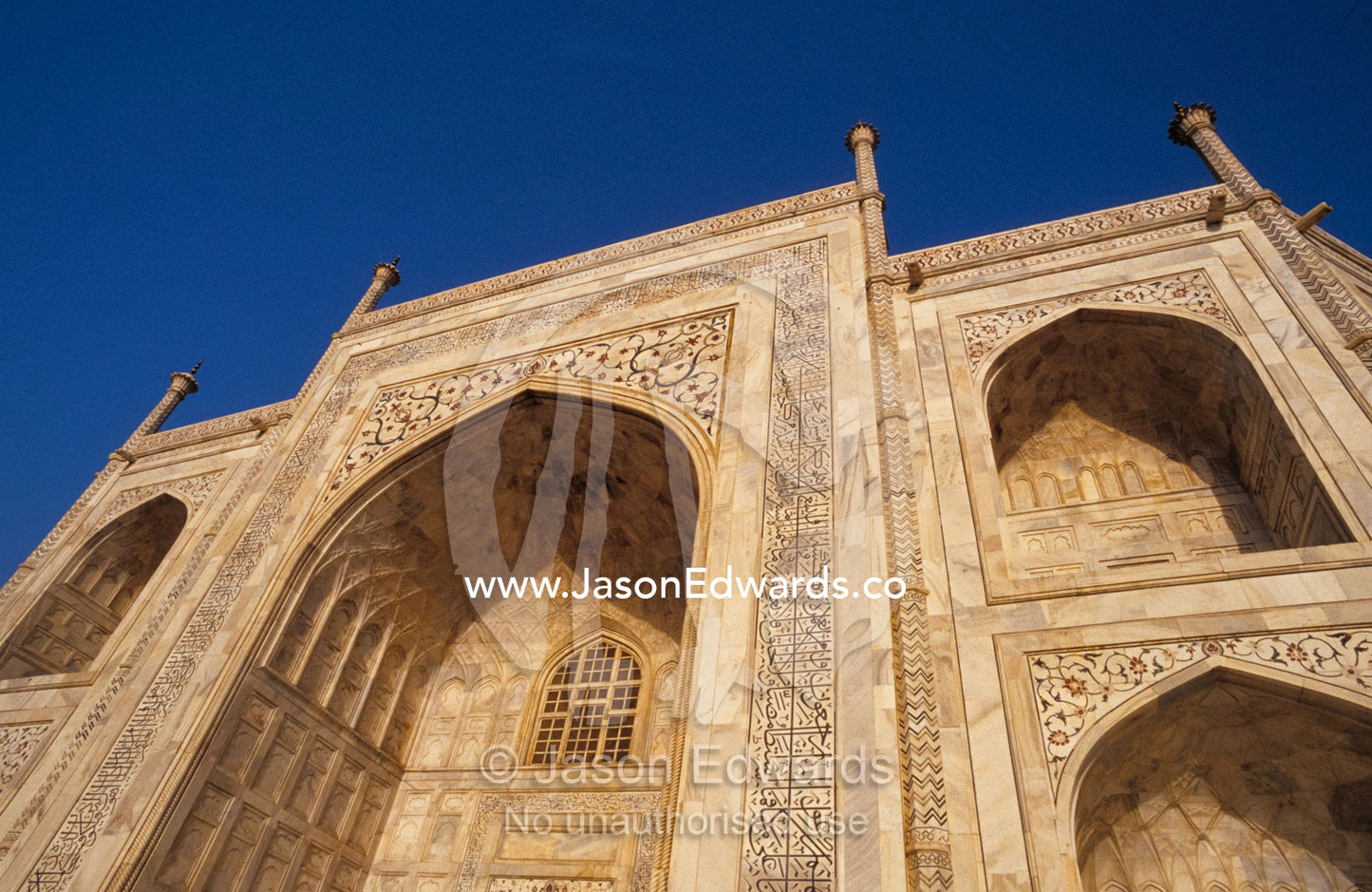 The Taj Mahal's pristine white marble with petra dura inlay carving. Agra, India.