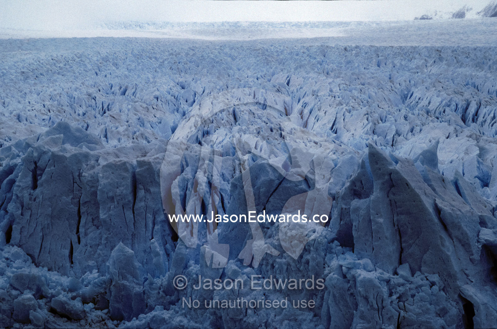 The jagged ice and fracture zone of a vast and menacing Glacier. Parque Nacional Los Glaciers, Patagonia, Argentina.