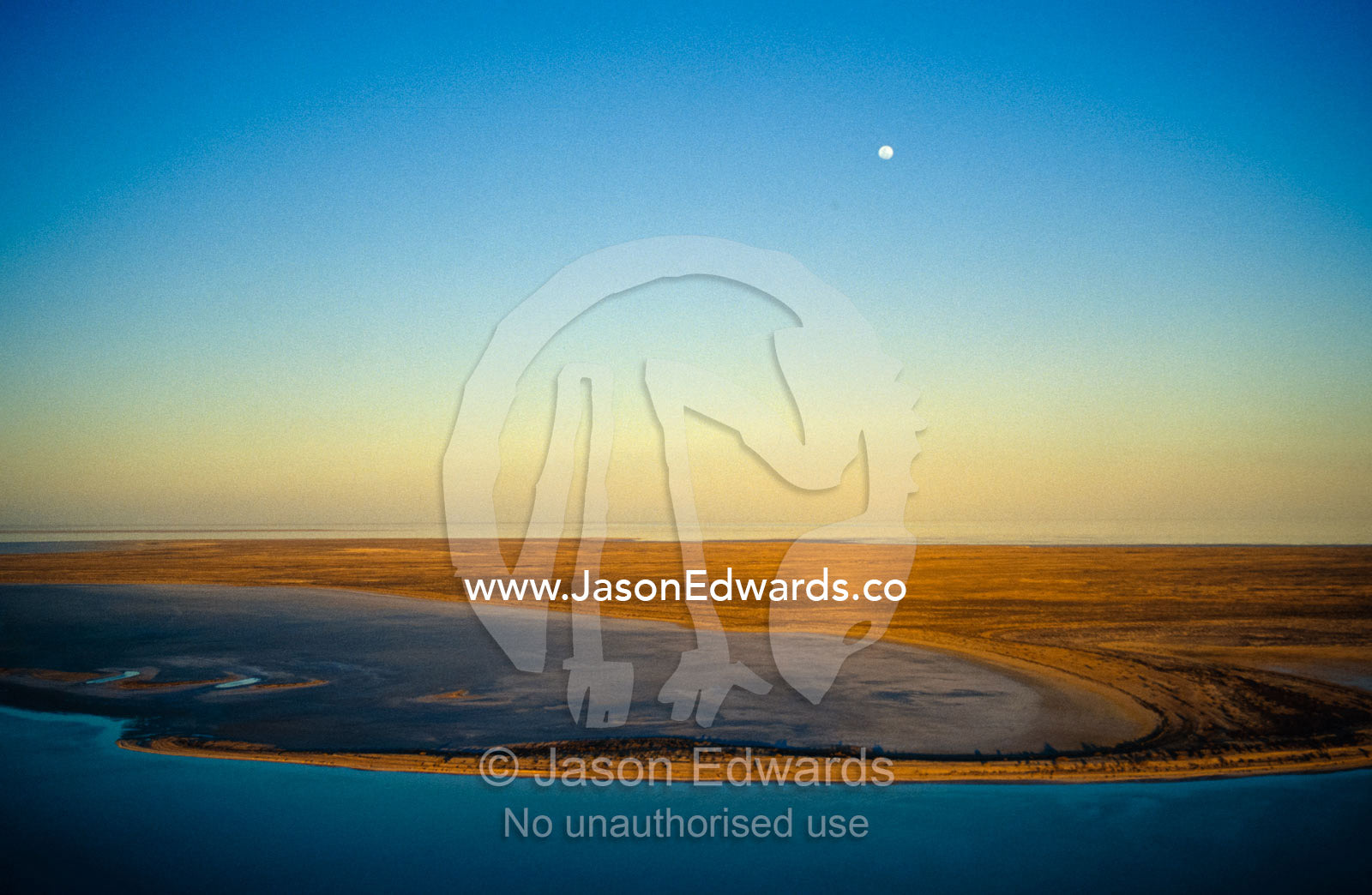Moonrise over Lake Eyre in flood in Australia's desert heart. Lake Eyre South National Park, South Australia, Australia.