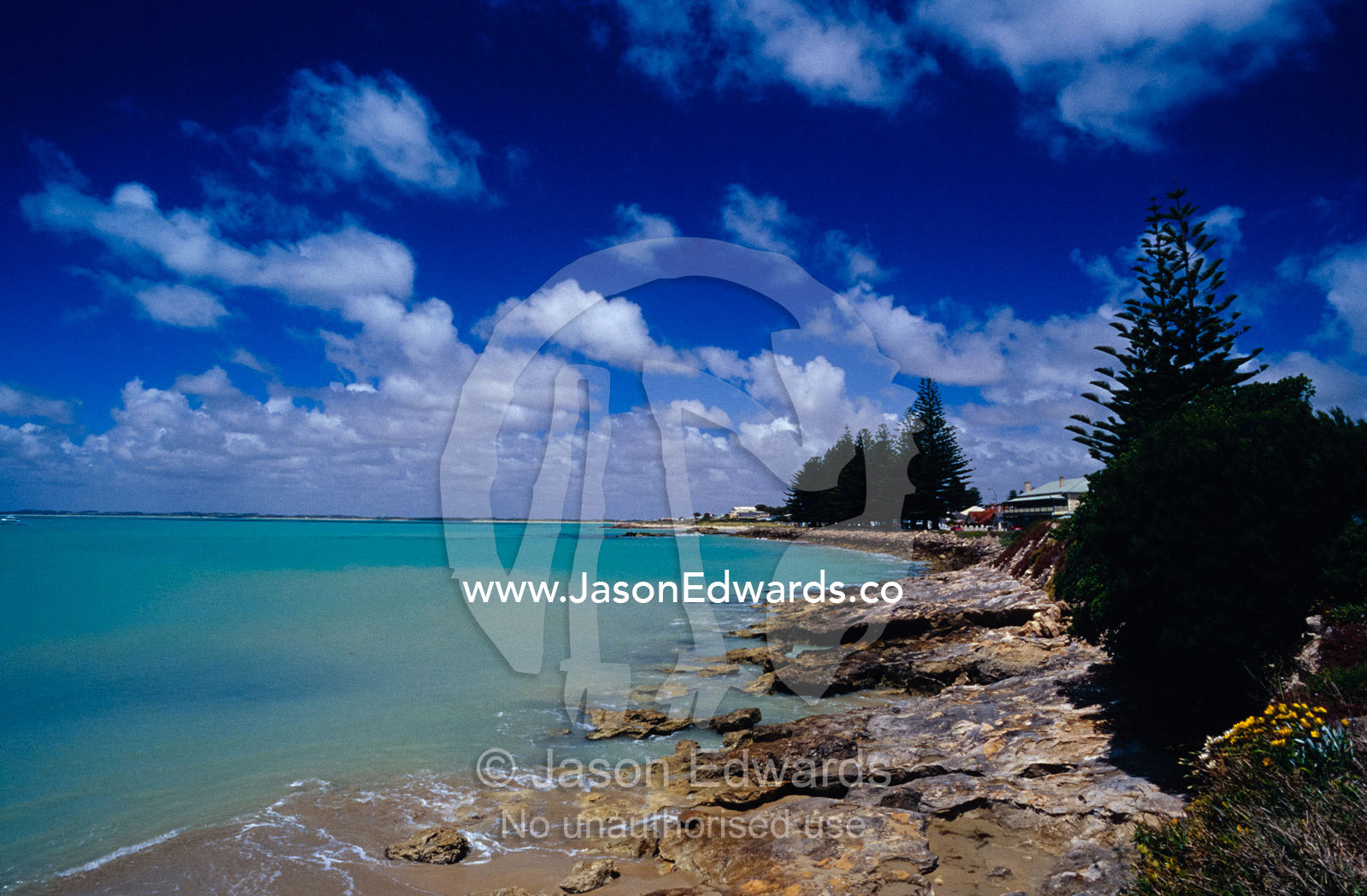 The rocky foreshore and picturesque bay of a coastal tourist resort. Robe, South Australia.