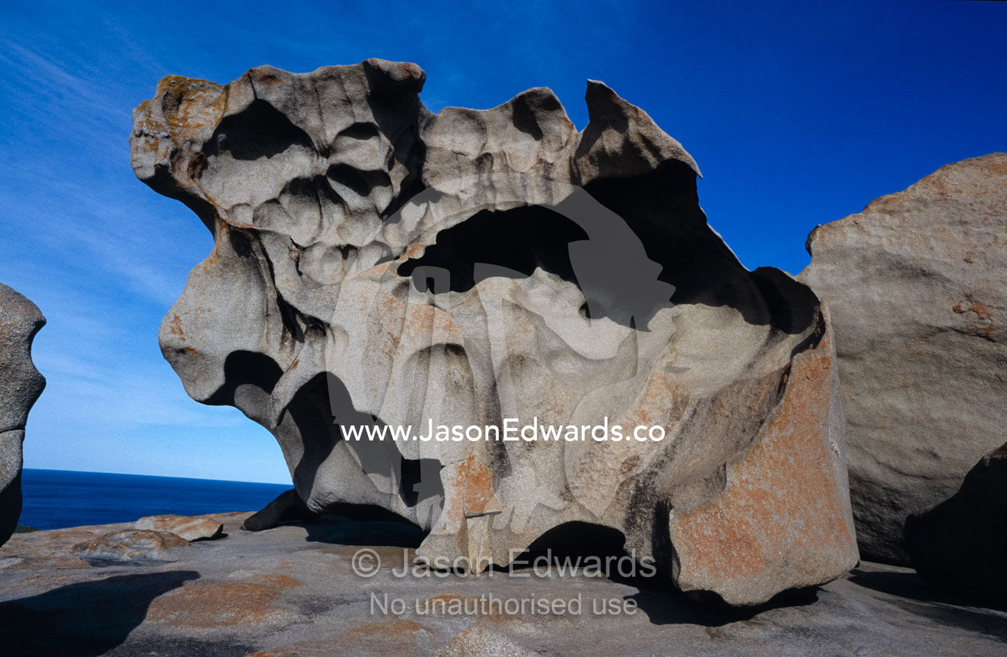 Orange Lichen on rocks and granite erosion in abstract formations. Kangaroo Island, South Australia.