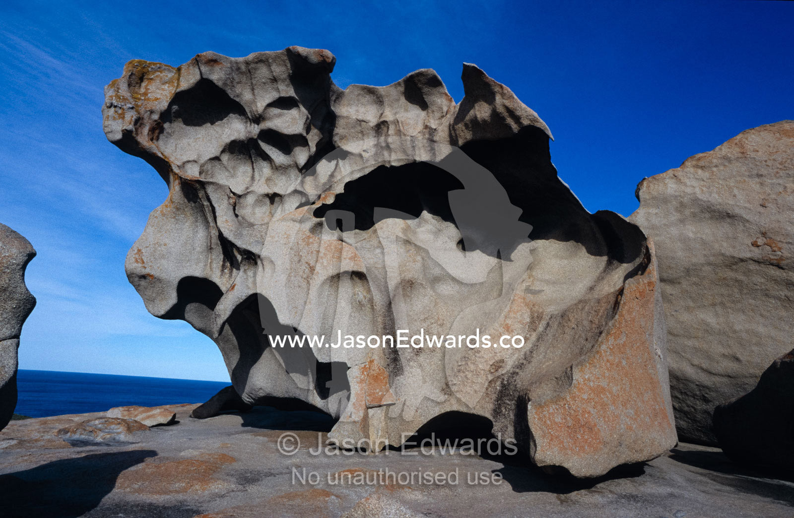 Orange Lichen on rocks and granite erosion in abstract formations. Kangaroo Island, South Australia.