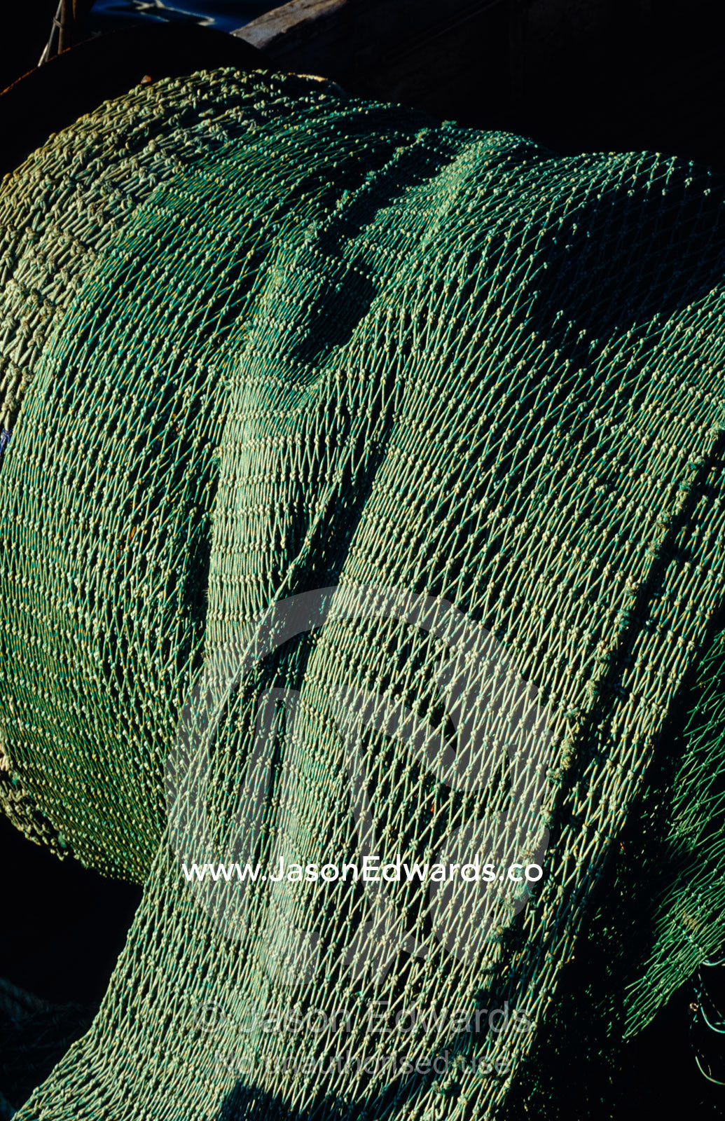 A massive coil of fishing net on a commercial fishing trawler. Eden, New South Wales, Australia.