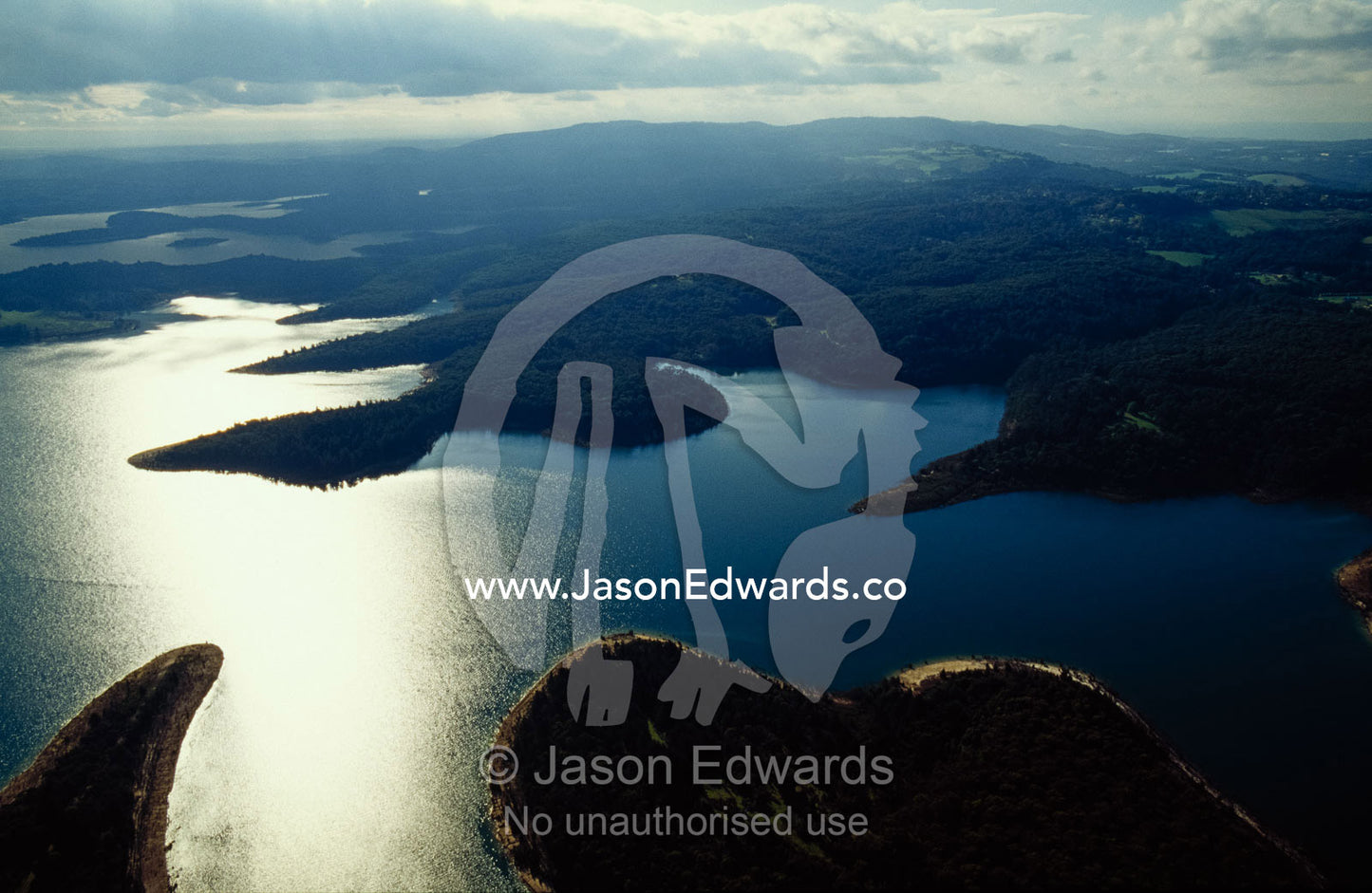 Late afternoon sunlight reflecting off the surface of the reservoir. Cardinia Reservoir, Victoria, Australia.