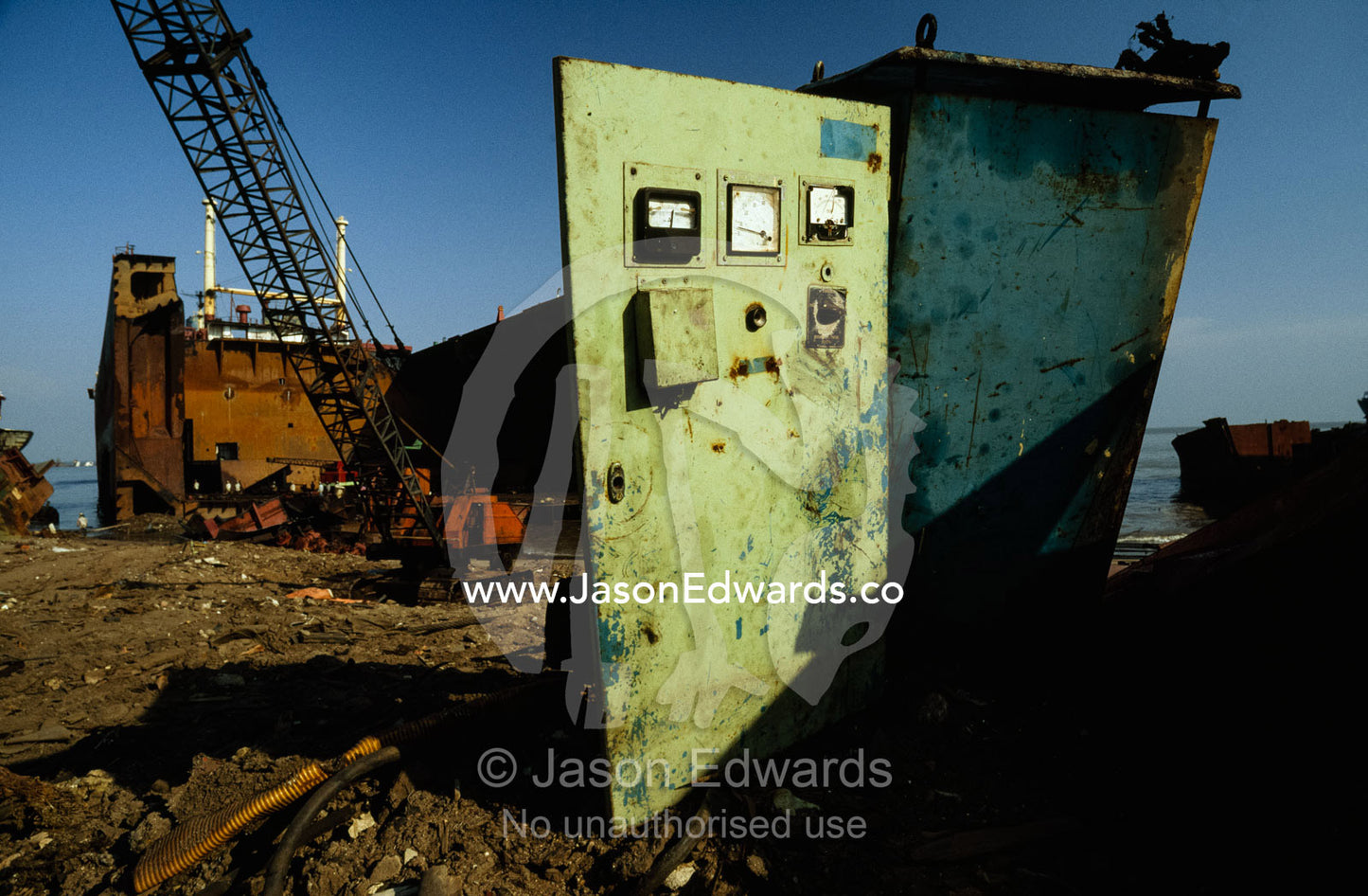 Partially dismantled ships at a ship breaking yard. Alang, Gujarat, India.