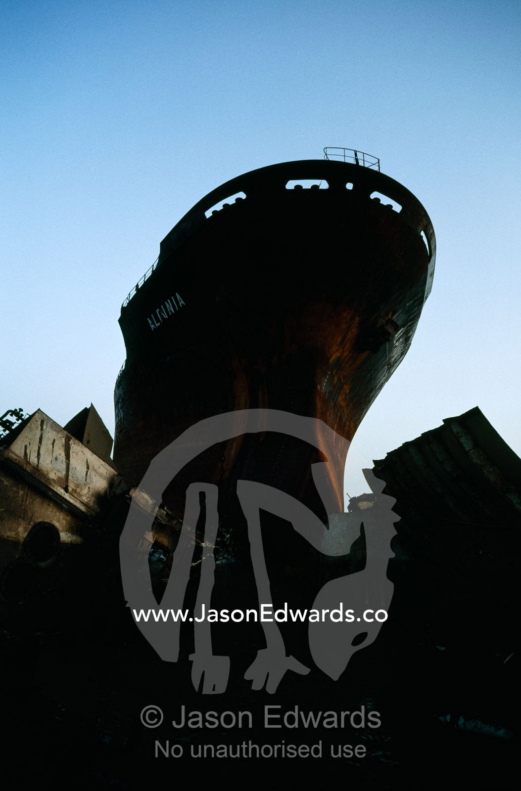 A tanker awaiting dismantling at a ship breaking yard. Alang Ship Breaking Yards, Gujarat State, India.