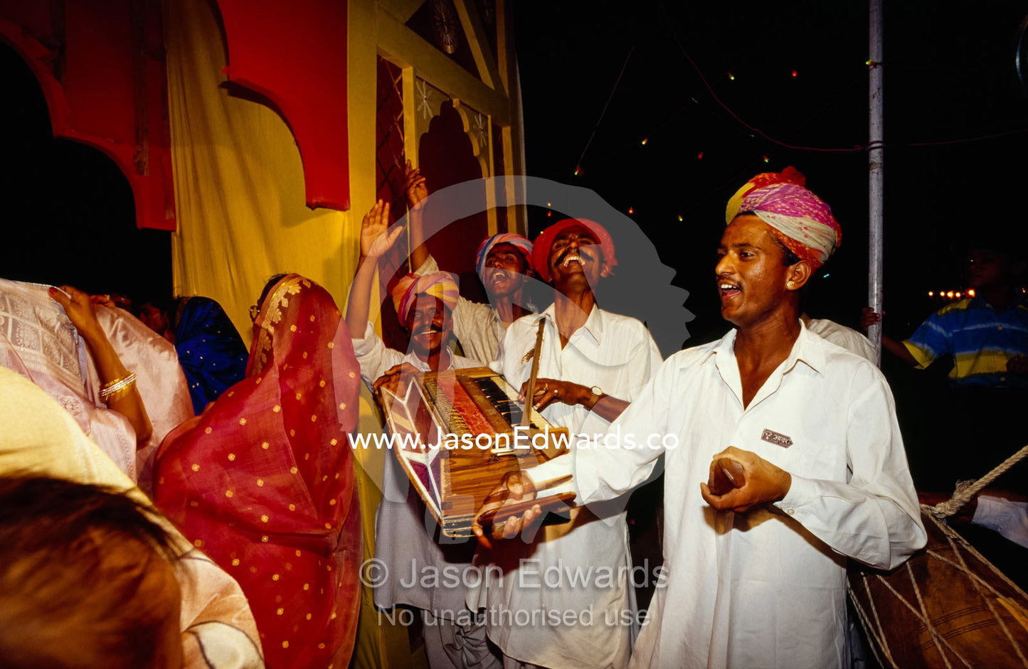 A band makes music at a ceremonial gateway at a Hindu wedding. Sawai Madhopur, Rajasthan State, India.