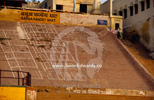 Graffiti of a plane flying into the World Trade center at a ghat. Ganges River bank, Varanasi (Benares), India.
