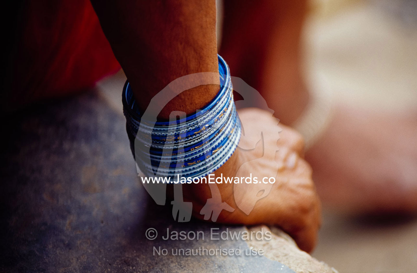Close up of a woman's wrist and bracelets. Varanasi (Benares), India.