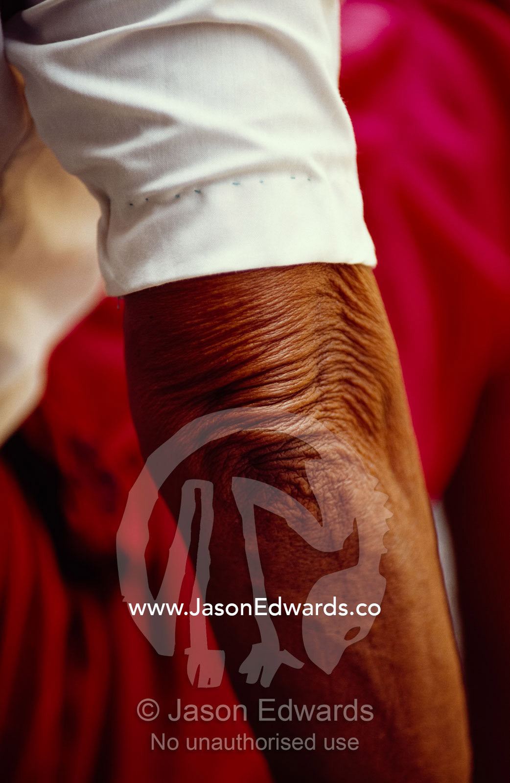 Close up of the sleeve and  wrinkled elbow of a woman. Varanasi (Benares), India.