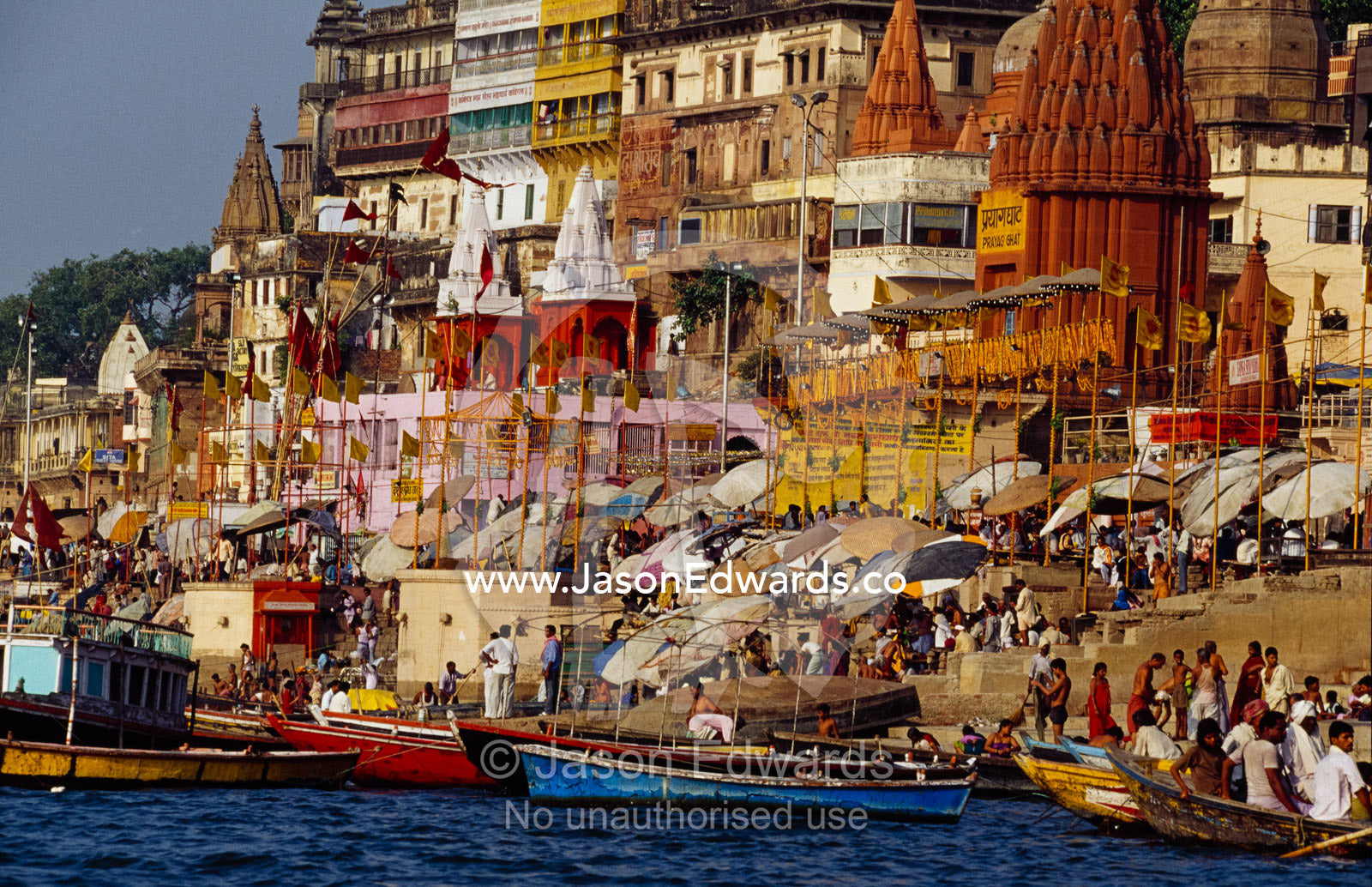 Crowds on the steps leading into the Ganges River. Varanasi (Benares), India.