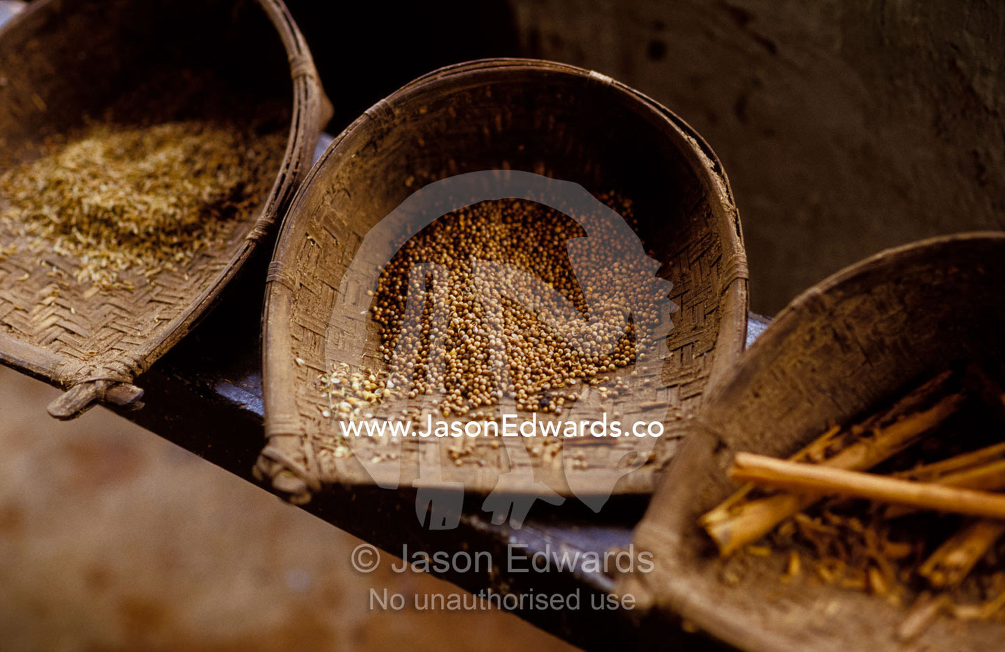 Organically grown herbs and spices stored in woven whicker scoops. Hill Country, Matale, Sri Lanka.