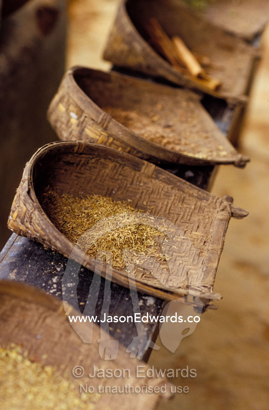Organically grown herbs and spices stored in woven whicker scoops. Hill Country, Matale, Sri Lanka.