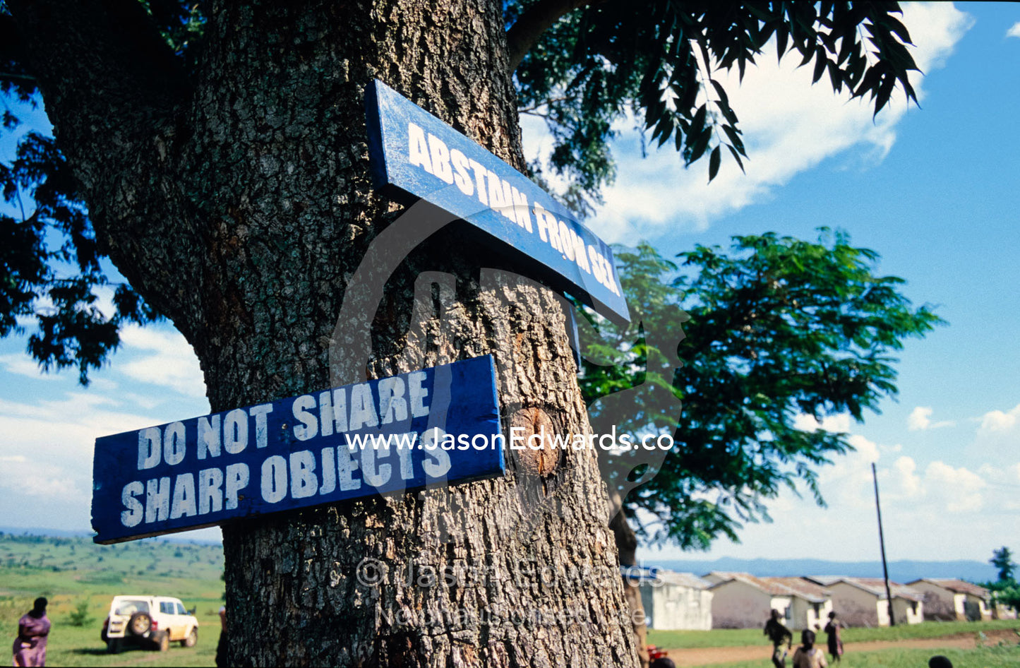 HIV AIDS warning graphics attached to trees in a school playground. Tororo Prison School, Tororo District, Uganda.