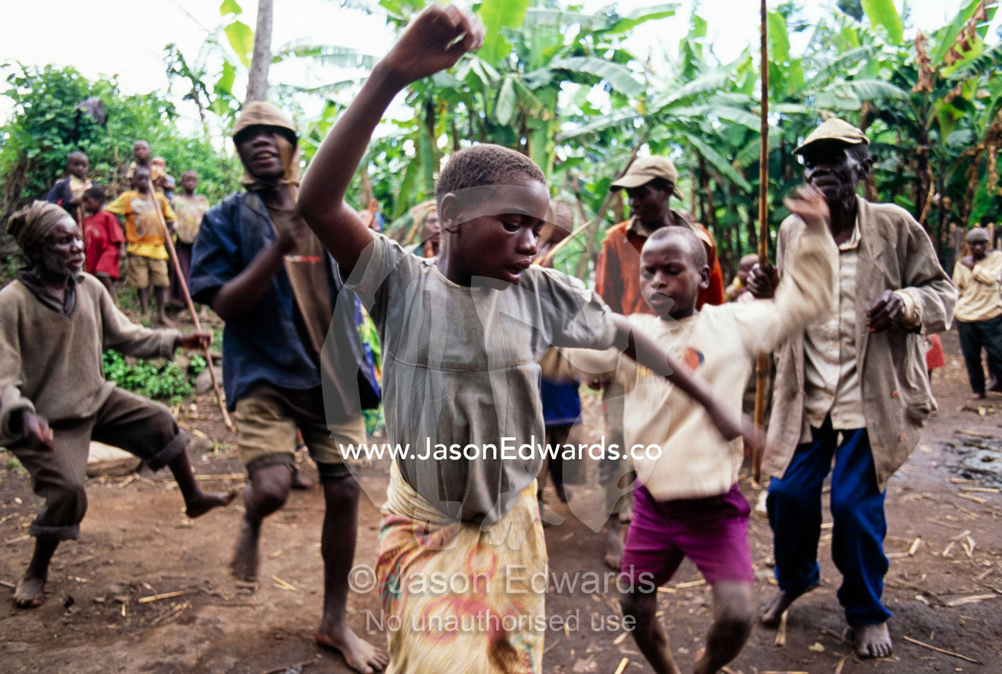 Displaced Batwa Forest People dancing at a cow initiation ceremony. Kisoro District, South Western Uganda.