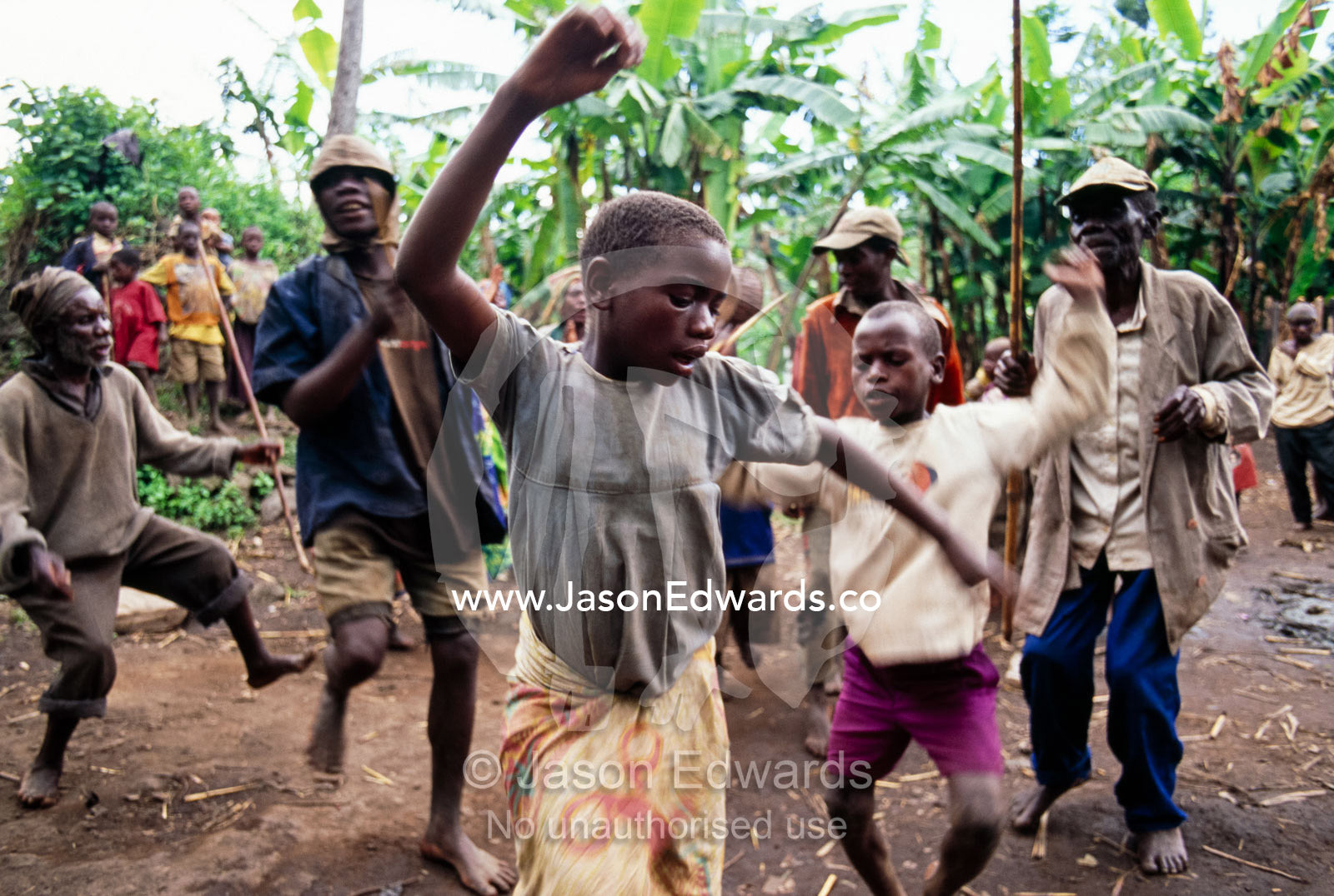 Displaced Batwa Forest People dancing at a cow initiation ceremony. Kisoro District, South Western Uganda.