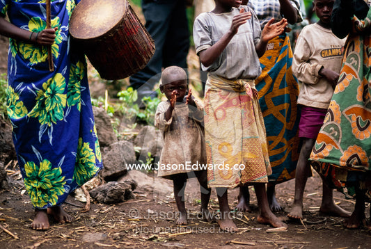 Displaced Batwa Forest People dancing at a cow initiation ceremony. Kisoro District, South Western Uganda.