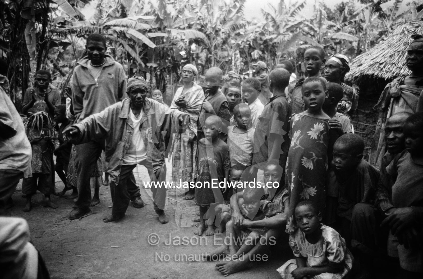 Displaced Batwa Forest People dancing at a cow initiation ceremony. Kisoro District, South Western Uganda.