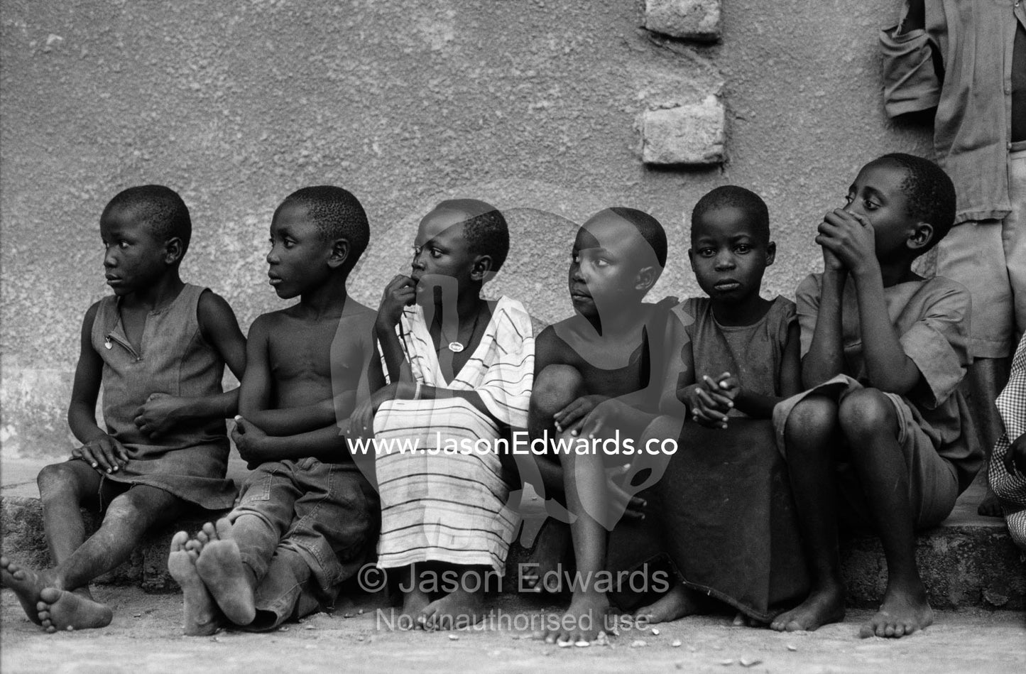 Village school children resting in the shade from the afternoon heat. Tororo District, Uganda.